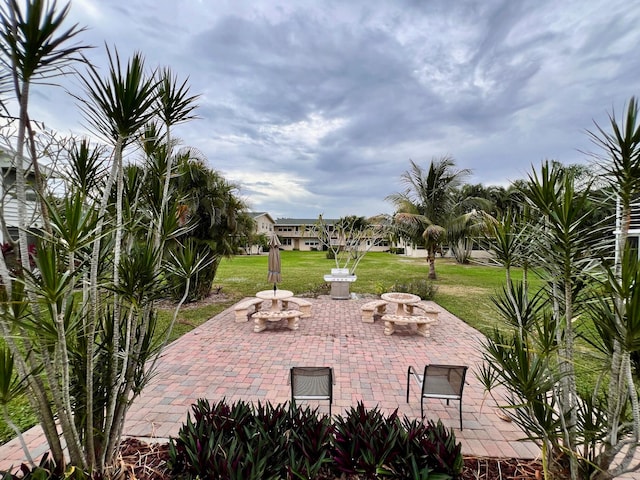 view of patio / terrace featuring an outdoor fire pit