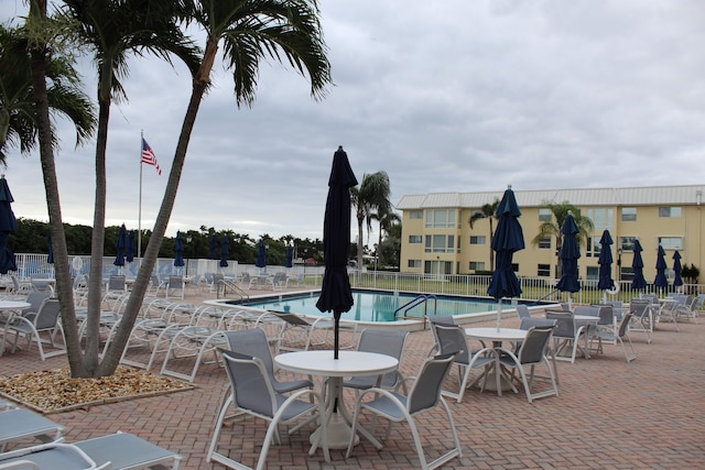 view of swimming pool with a patio