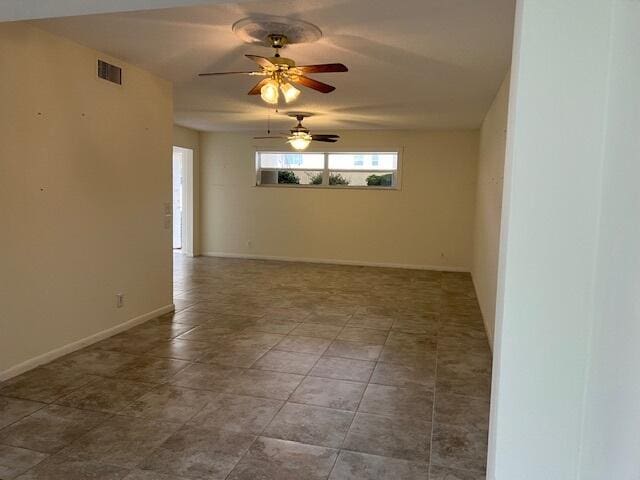 unfurnished room featuring ceiling fan