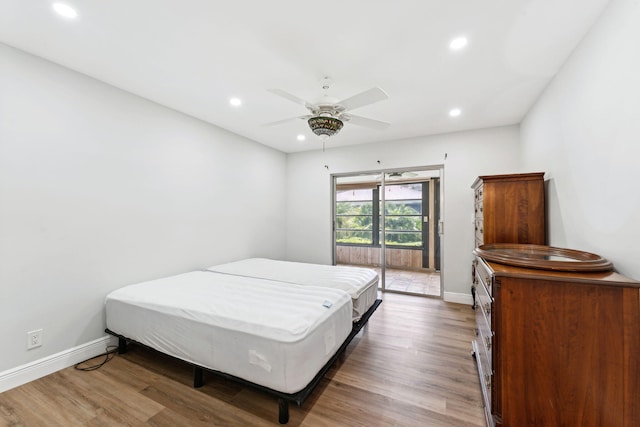 bedroom featuring hardwood / wood-style flooring and ceiling fan