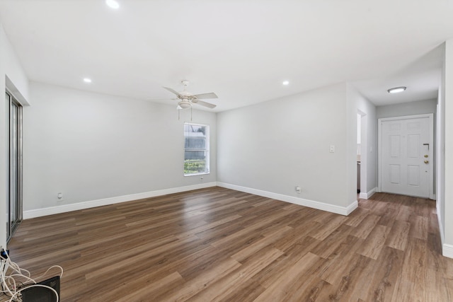 spare room featuring ceiling fan and wood-type flooring