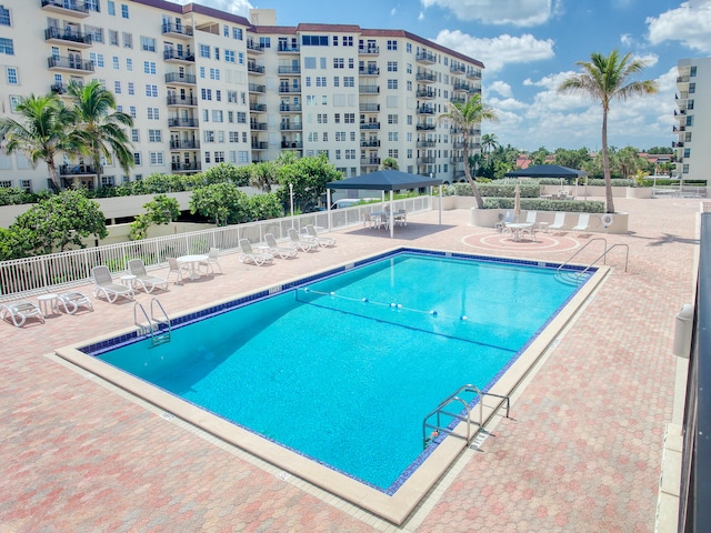 view of swimming pool with a patio area