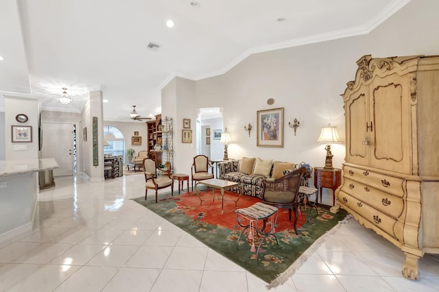 living room featuring ceiling fan, light tile patterned floors, and crown molding