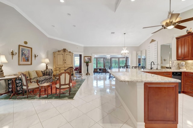 kitchen featuring sink, decorative backsplash, decorative light fixtures, light tile patterned flooring, and light stone counters