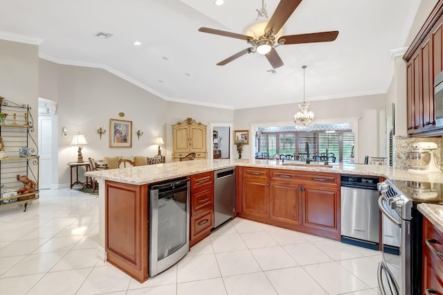 kitchen with lofted ceiling, hanging light fixtures, ornamental molding, kitchen peninsula, and beverage cooler