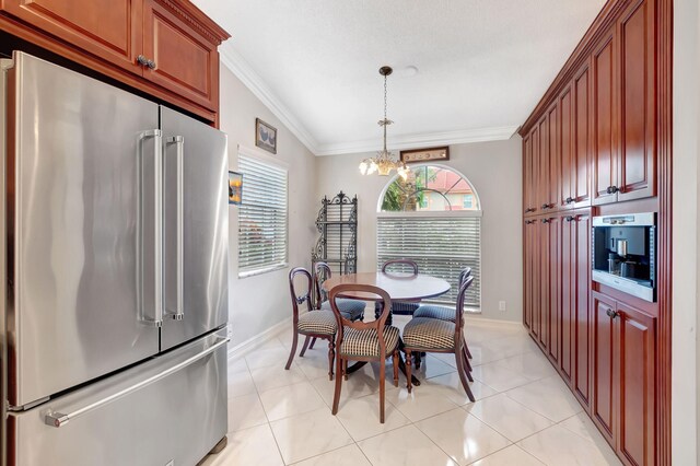 dining area featuring vaulted ceiling, light tile patterned flooring, ornamental molding, and a chandelier