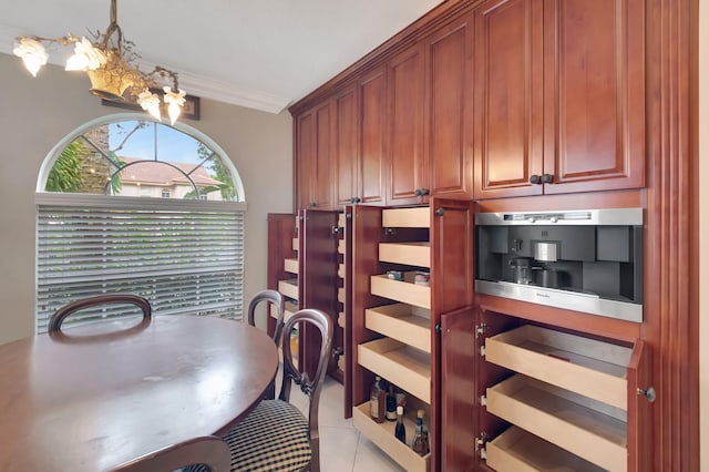 tiled dining space featuring crown molding