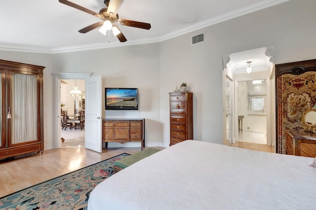 bedroom with ceiling fan, ensuite bath, ornamental molding, and light hardwood / wood-style flooring