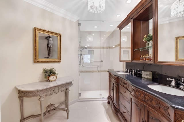 bathroom with vanity, a shower with shower door, and ornamental molding