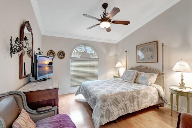 bedroom with ceiling fan, light hardwood / wood-style flooring, and ornamental molding