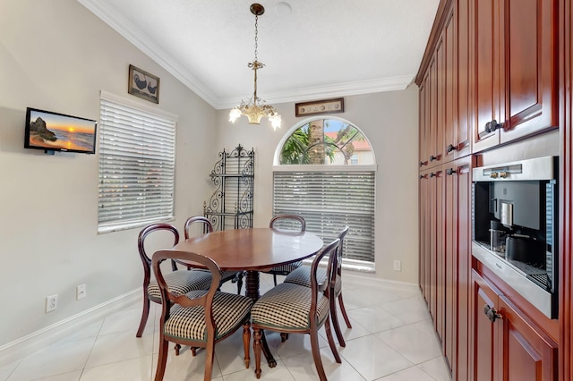 tiled dining area with vaulted ceiling, an inviting chandelier, and ornamental molding