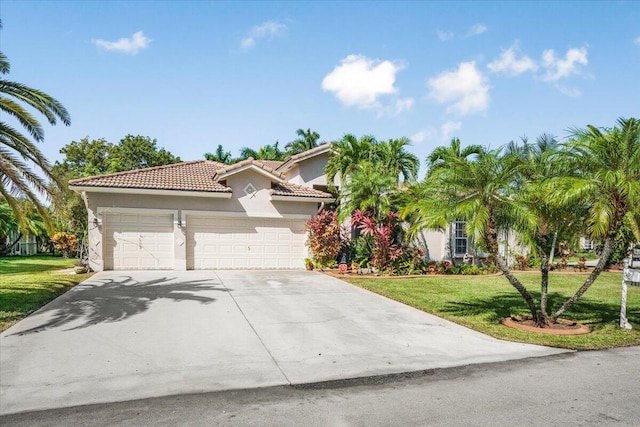 mediterranean / spanish-style home featuring a front lawn and a garage