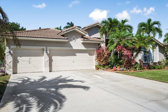 mediterranean / spanish-style house featuring a garage