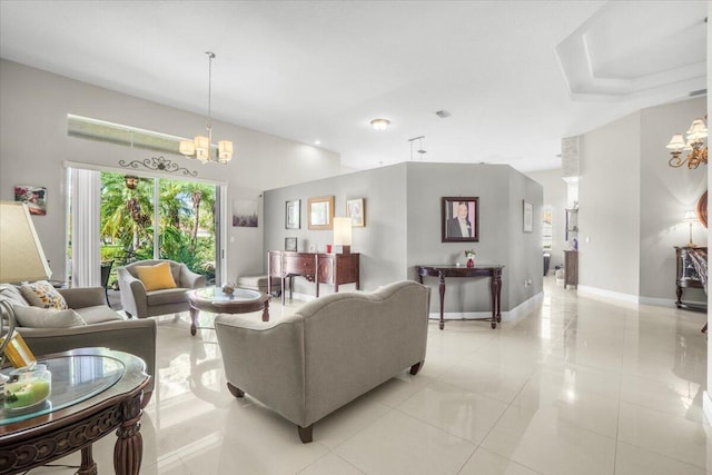 tiled living room featuring a notable chandelier