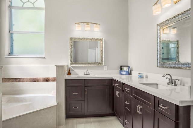 bathroom featuring a bathing tub and vanity