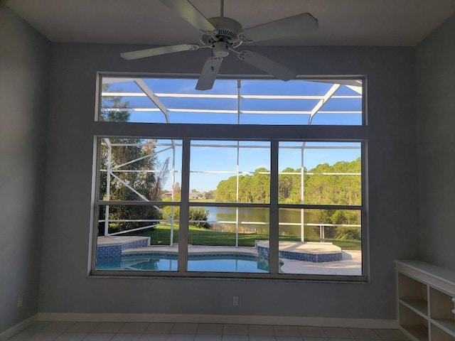 room details with ceiling fan and a water view