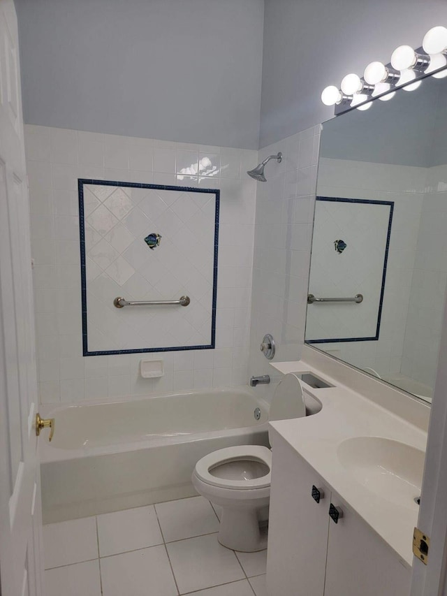 full bathroom with tile patterned floors, toilet, vanity, and tiled shower / bath