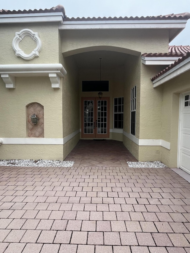 entrance to property featuring french doors