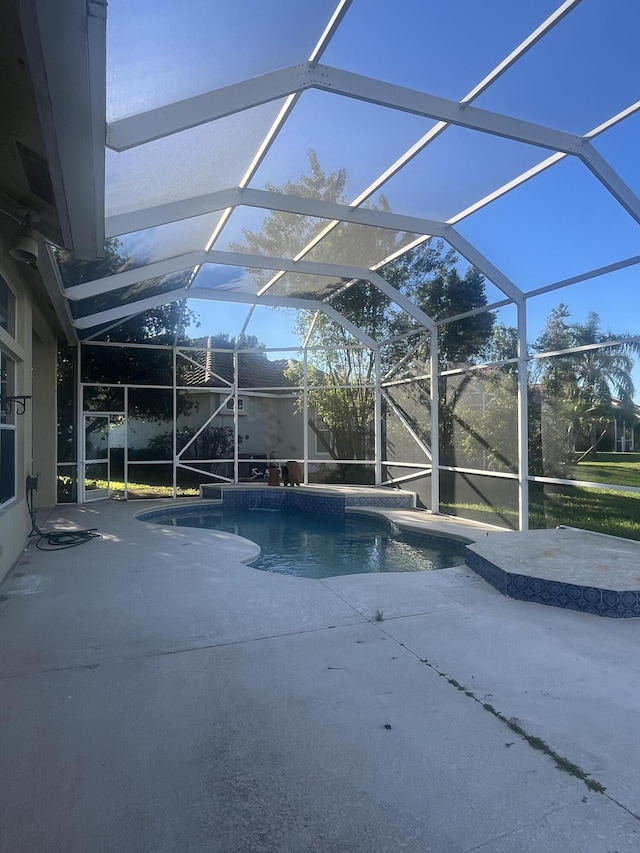 view of pool featuring a patio area and a lanai