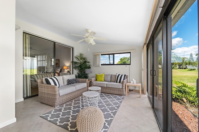 sunroom / solarium with ceiling fan and lofted ceiling