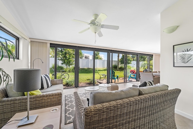 tiled living room with ceiling fan