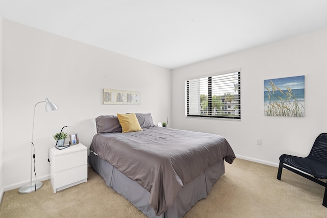 bedroom featuring light colored carpet