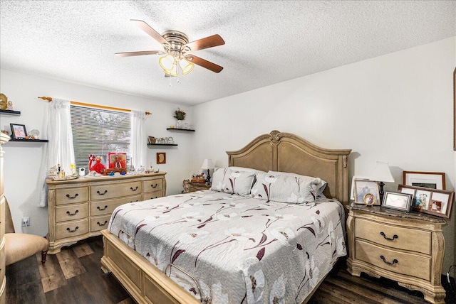 bedroom featuring ceiling fan, dark wood-type flooring, and a textured ceiling