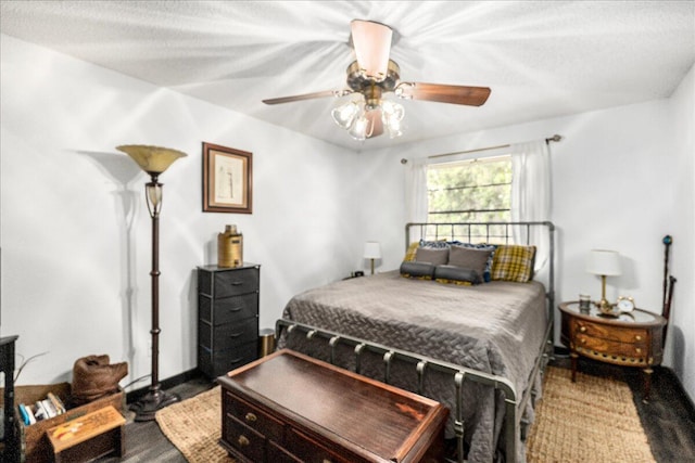 bedroom featuring hardwood / wood-style floors and ceiling fan