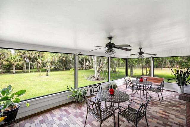 sunroom / solarium with ceiling fan