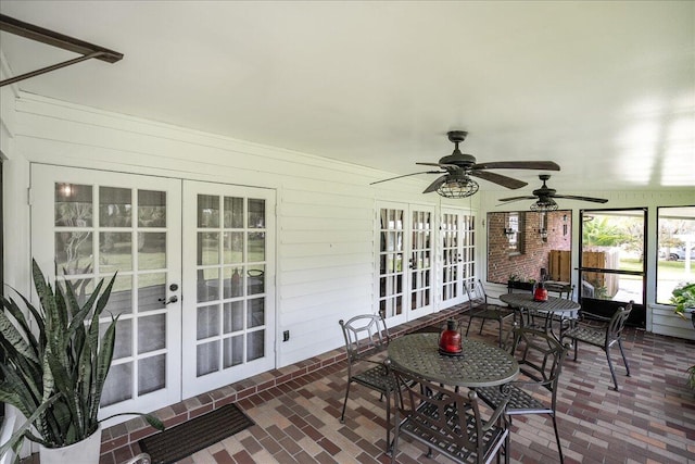 sunroom with ceiling fan and french doors