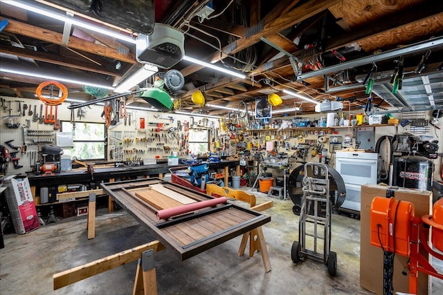 garage featuring a workshop area and a garage door opener