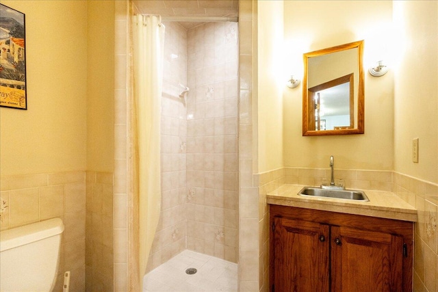 bathroom with vanity, toilet, and walk in shower