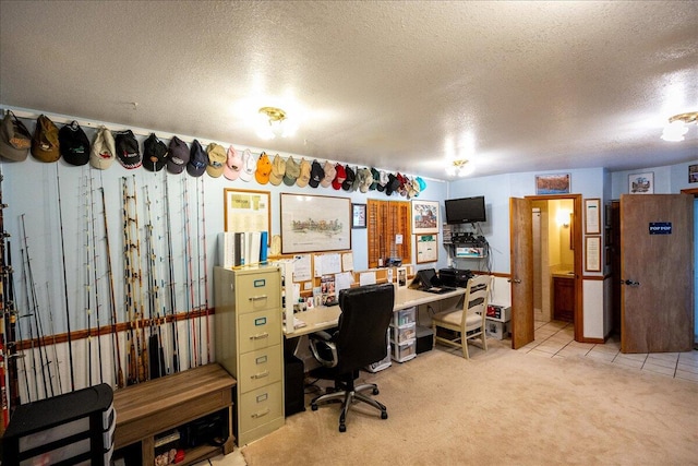 office area featuring a textured ceiling and light carpet