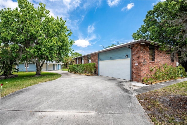 view of front of home with a garage and a front yard