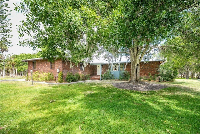 ranch-style house with a front lawn