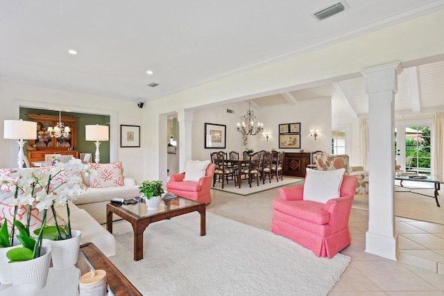 tiled living room with beamed ceiling, ornate columns, ornamental molding, and an inviting chandelier