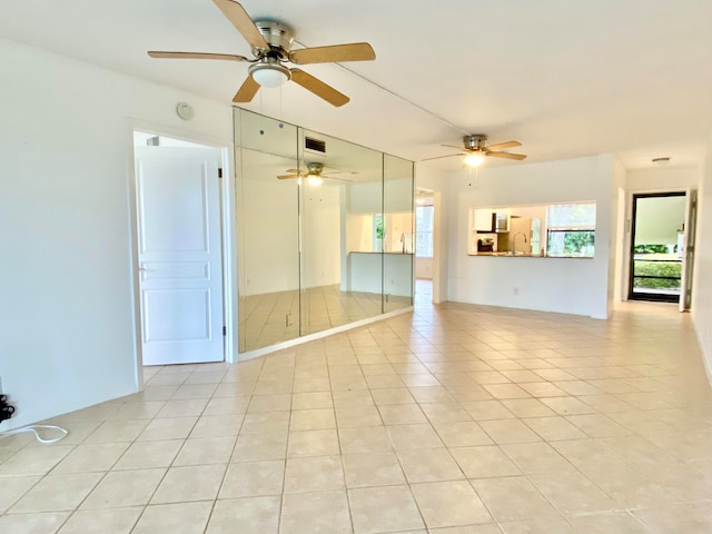 spare room featuring light tile patterned floors