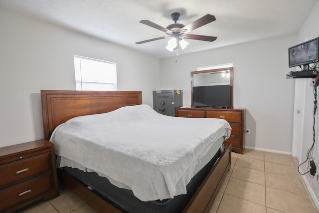 bedroom featuring ceiling fan and light tile patterned floors