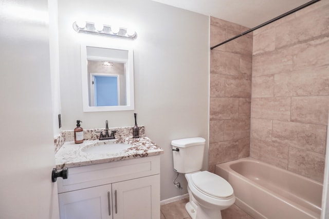 full bathroom with tile patterned flooring, vanity, toilet, and tiled shower / bath