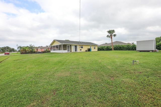 view of yard with a sunroom