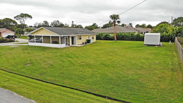 view of yard featuring a sunroom