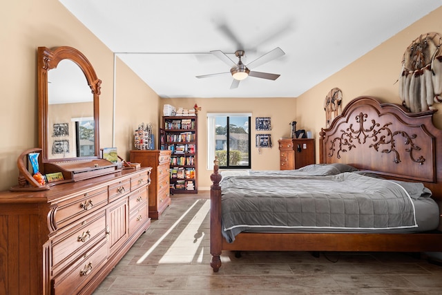 bedroom with wood finished floors and a ceiling fan