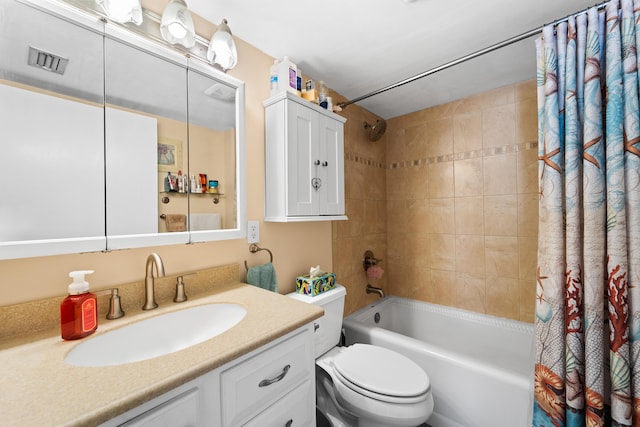 bathroom featuring vanity, toilet, shower / bath combo with shower curtain, and visible vents