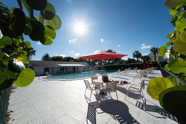 pool featuring a patio and fence