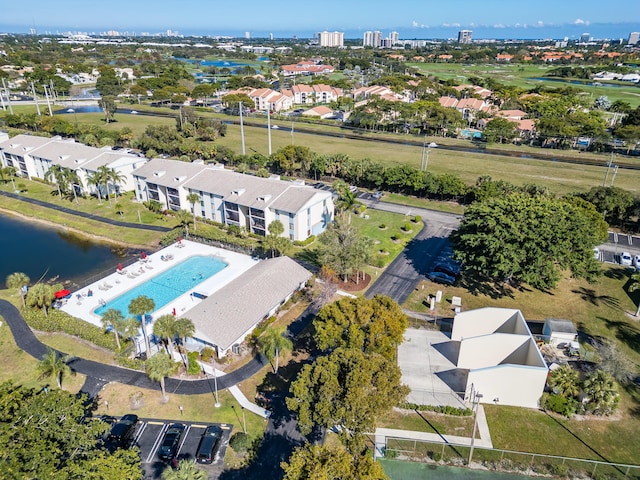 birds eye view of property featuring a water view and a residential view