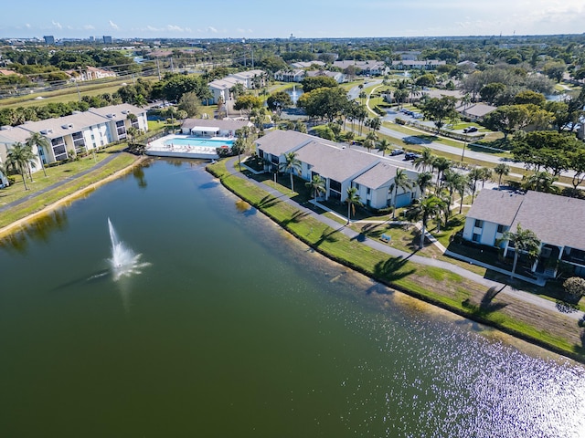 birds eye view of property featuring a residential view and a water view