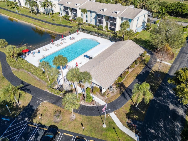 birds eye view of property with a water view