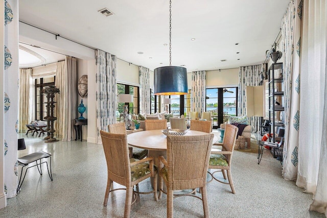 dining room featuring plenty of natural light