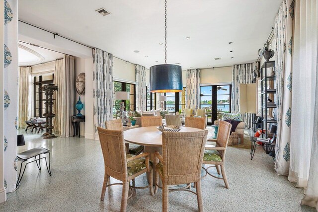 813 N Atlantic Dr, Lantana, FL 33462 - dining area with dark aggregate flooring, baseboards, and recessed lighting