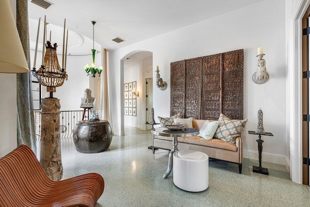 813 N Atlantic Dr, Lantana, FL 33462 - sitting room with speckle patterned floor, arched walkways, and baseboards